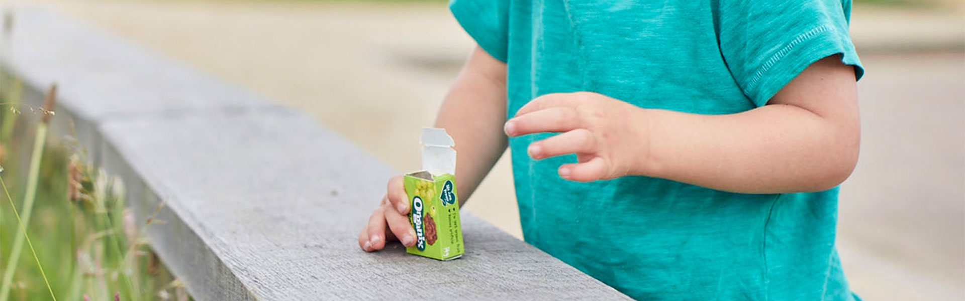 Young child with box of raisins 