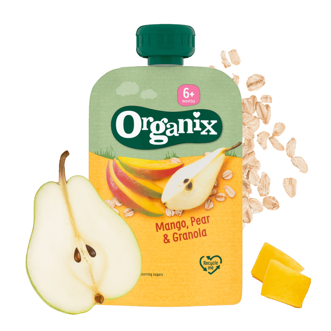A mango pear and Granola pouch with ingredients around including fresh pear and oats.