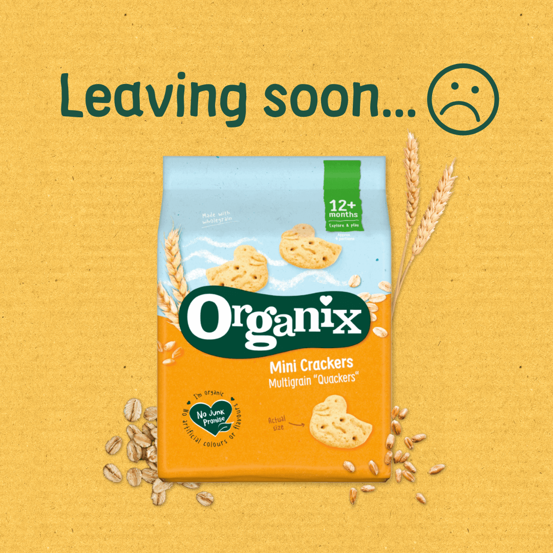Organix Mini Crackers Multigrain 'Quackers' pack shown against a yellow background with the message 'Leaving soon...' and a sad face. The orange and blue packaging features the Organix logo and states it's suitable for 12+ months, surrounded by illustrations of wheat and grains.